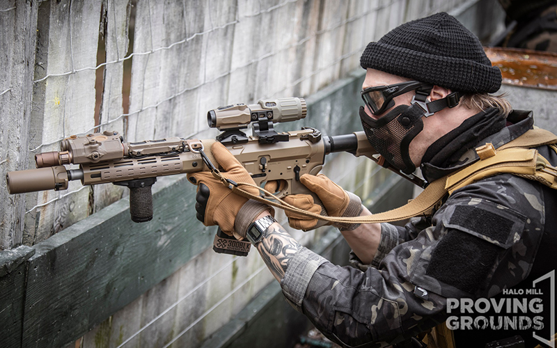 An Airsofter with a tan setup and face protection.