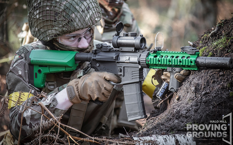 An Airsofter with a two-tone rifle.