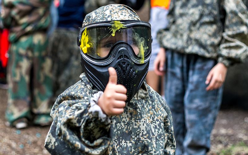 A young paintballer giving a thumb's up!